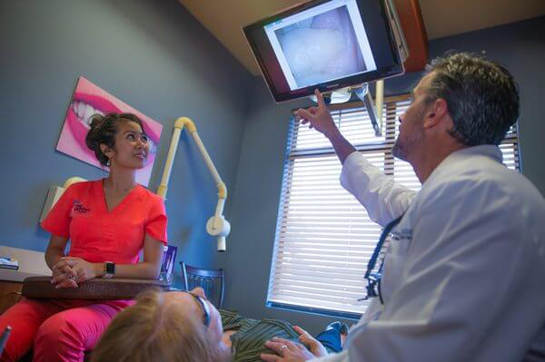 Dr. Dickson with patients at My Dentist in Plano