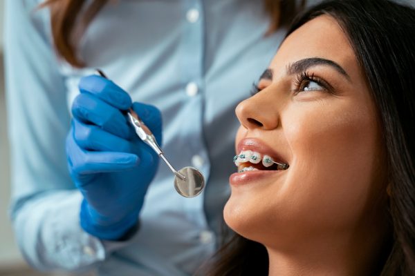 girl with brace visiting the dentist